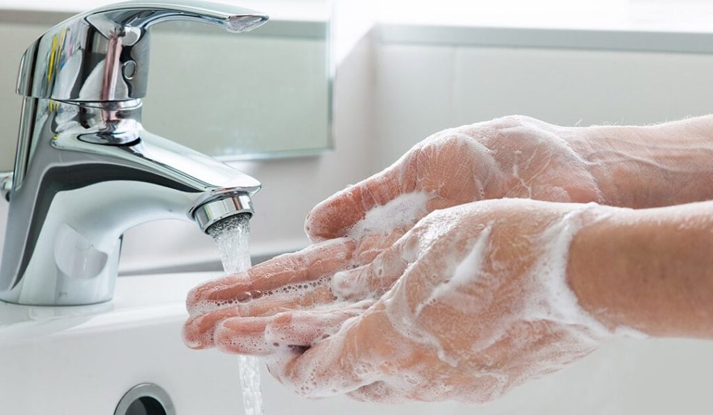 Person washing hands - Dial Professional Antibacterial Liquid Hand Soap