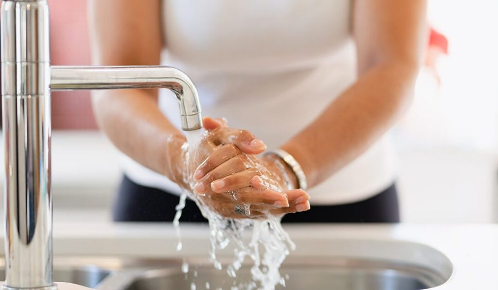 Person washing hands - Dial Professional