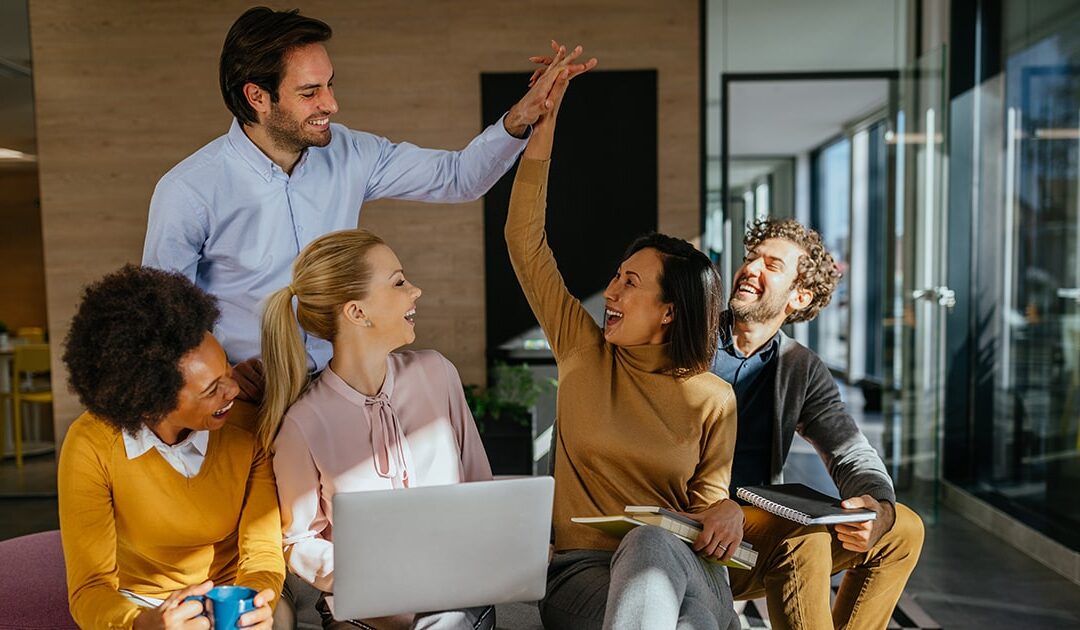 Group of people in a work setting - team huddles