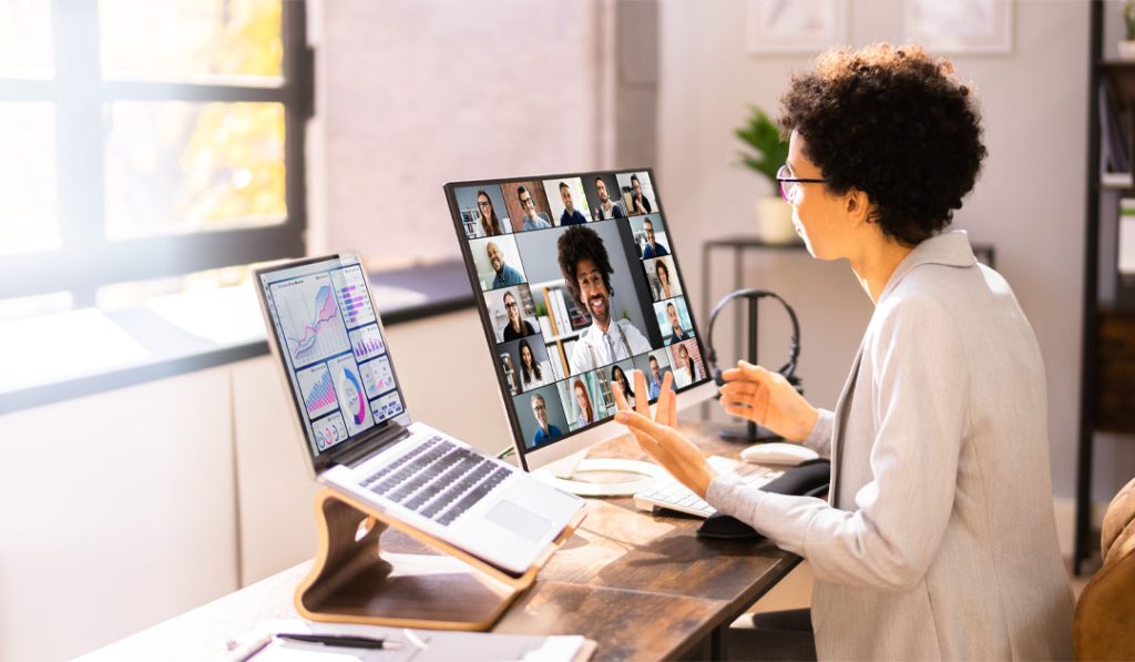 Person giving a presentation on computer - Microsoft PowerPoint