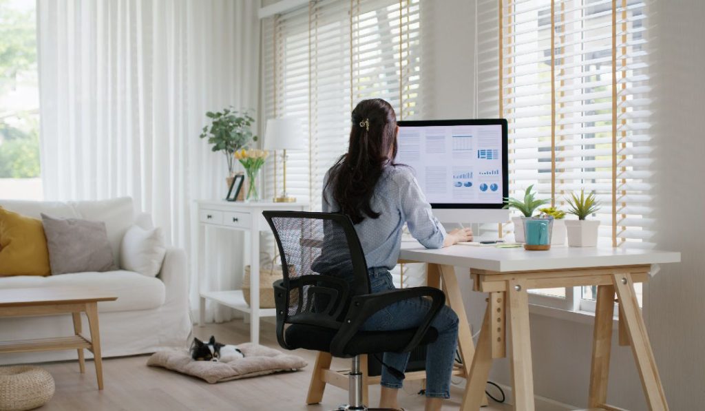 Female at a desk in a home office - hybrid work - remote work